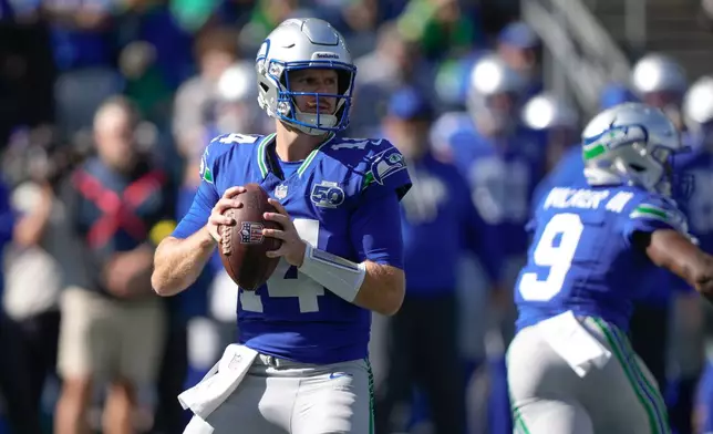 Seattle Seahawks quarterback Sam Darnold (14) looks to throw during the first half of an NFL football game against the Tampa Bay Buccaneers, Sunday, Oct. 5, 2025, in Seattle. (AP Photo/Stephen Brashear)