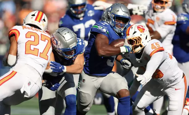 Seattle Seahawks running back Kenneth Walker III (9) runs with the ball during the second half of an NFL football game against the Tampa Bay Buccaneers, Sunday, Oct. 5, 2025, in Seattle. (AP Photo/Maddy Grassy)