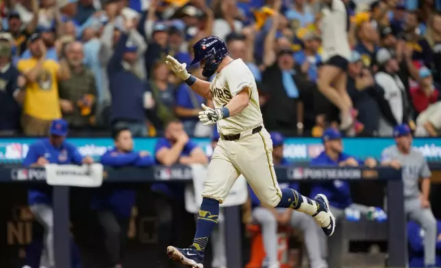Milwaukee Brewers' Andrew Vaughn (28) runs the bases after hitting a 3-run home run during the first inning of Game 2 of baseball's National League Division against the Chicago Cubs Series Monday, Oct. 6, 2025, in Milwaukee. (AP Photo/Kayla Wolf)