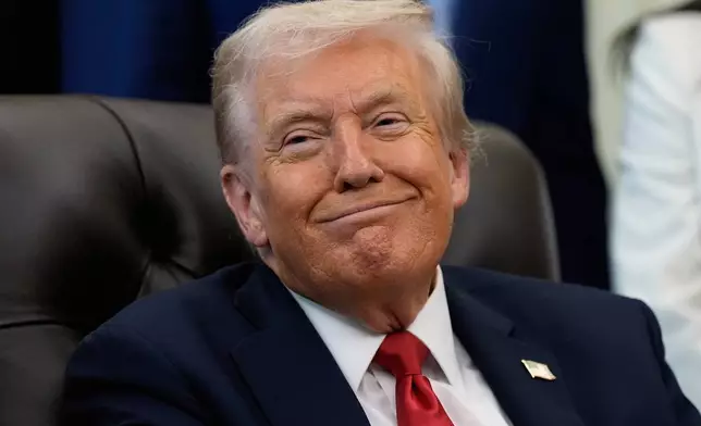 President Donald Trump listens as Sen. Katie Britt, R-Ala., speaks in the Oval Office of the White House, Thursday, Oct. 16, 2025, in Washington. (AP Photo/Alex Brandon)