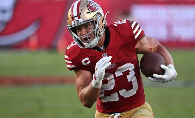 San Francisco 49ers running back Christian McCaffrey (23) runs against the Tampa Bay Buccaneers during the second half of an NFL football game in Tampa, Fla., Sunday, Oct. 12, 2025. (AP Photo/Jason Behnken)
