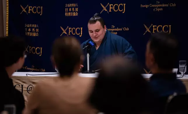 Ukrainian sumo wrestler Danilo Yavhushyshyn, known by his Japanese name Aonishiki Arata, speaks during a press conference at the Foreign Correspondents' Club of Japan, in Tokyo, Thursday, Oct. 9, 2025. (AP Photo/Louise Delmotte)