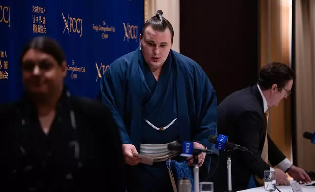 Ukrainian sumo wrestler Danilo Yavhushyshyn, known by his Japanese name Aonishiki Arata, leaves a press conference at the Foreign Correspondents' Club of Japan, in Tokyo, Thursday, Oct. 9, 2025. (AP Photo/Louise Delmotte)