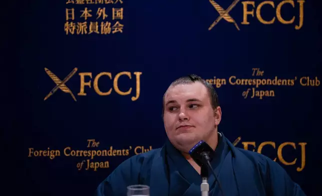 Ukrainian sumo wrestler Danilo Yavhushyshyn, known by his Japanese name Aonishiki Arata, speaks during a press conference at the Foreign Correspondents' Club of Japan, in Tokyo, Thursday, Oct. 9, 2025. (AP Photo/Louise Delmotte)