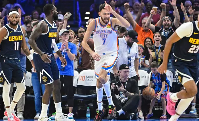 Oklahoma City Thunder center/forward Chet Holmgren (7) celebrates during the first half of a preseason NBA basketball game against the Denver Nuggets, Friday, Oct. 17, 2025, in Oklahoma City. (AP Photo/Gerald Leong)