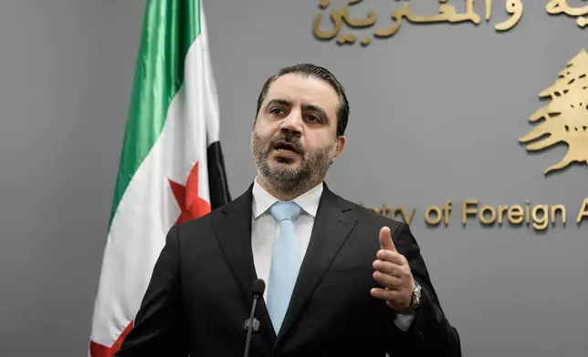 Syrian Foreign Minister Asaad al-Shibani speaks during a briefing for journalists after his meeting with Lebanese Foreign Minister Youssef Rajji in Beirut, Lebanon, Friday, Oct. 10, 2025. (AP Photo/Hassan Ammar)