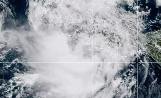 This NOAA satellite image taken at 2:12 p.m. EST on Thursday, Oct. 9, 2025, shows Tropical Storm Raymond off the western coast of Mexico in the eastern Pacific Ocean. (NOAA via AP)