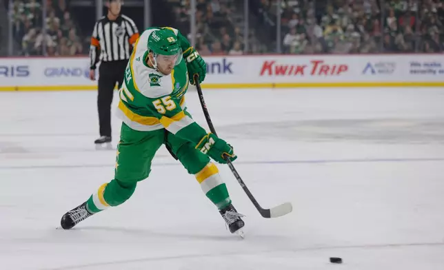 Minnesota Wild defenseman David Jiricek (55) takes a slapshot during the first period of an NHL hockey game against the Utah Mammoth, Saturday, Oct. 25, 2025, in St. Paul, Minn. (AP Photo/Bailey Hillesheim)