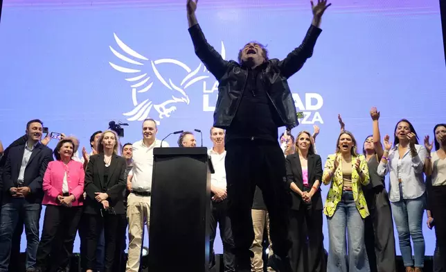 President Javier Milei addresses supporters at a rally for his party's candidates ahead of the upcoming midterm elections, in Rosario, Argentina, Thursday, Oct. 23, 2025. (AP Photo/Rodrigo Abd)