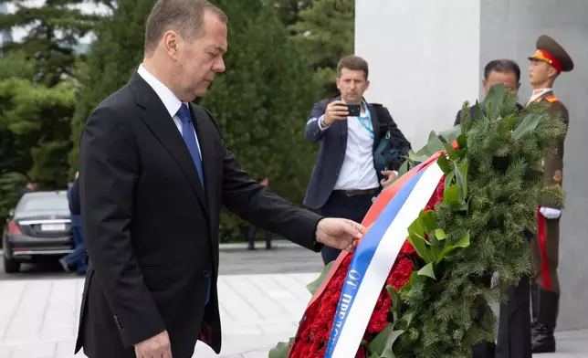 Russian Security Council Deputy Chairman and the head of the United Russia party Dmitry Medvedev attends a wreath laying ceremony at the statues of former North Korean leaders Kim Il Sung and Kim Jong Il on Mansu Hill in Pyongyang, North Korea, on Thursday, Oct. 9, 2025. (Ekaterina Shtukina, Sputnik Pool Photo via AP)