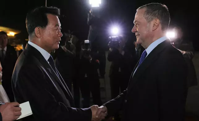 Russian Security Council Deputy Chairman and the head of the United Russia party Dmitry Medvedev, right, is greeted by North Korean Deputy Foreign Minister Im Cheon Il upon his arrival in Pyongyang, North Korea, Wednesday, Oct. 8, 2025, on the occasion of the 80th anniversary of the founding of North Korea's ruling Worker's Party of Korea. (Ekaterina Shtukina, Sputnik, Pool Photo via AP)