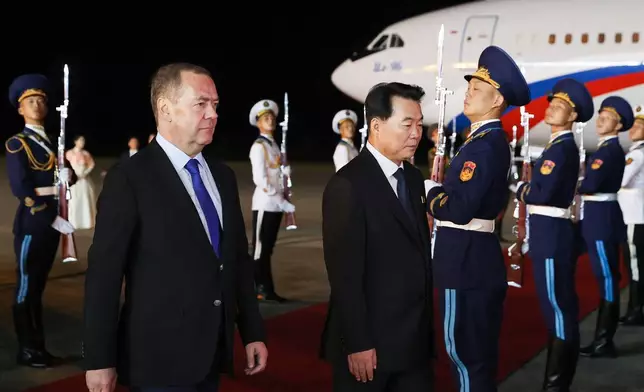 Russian Security Council Deputy Chairman and the head of the United Russia party Dmitry Medvedev, left, is greeted by North Korean Deputy Foreign Minister Im Cheon Il upon his arrival in Pyongyang, North Korea, Wednesday, Oct. 8, 2025, on the occasion of the 80th anniversary of the founding of North Korea's ruling Worker's Party of Korea. (Ekaterina Shtukina, Sputnik, Pool Photo via AP)