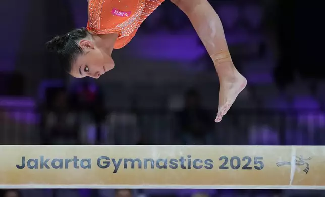Sophia Weisberg of Brazil competes on the balance beam during the 53rd Artistic Gymnastics World Championships in Jakarta, Indonesia, Tuesday, Oct. 21, 2025. (AP Photo/Dita Alangkara)