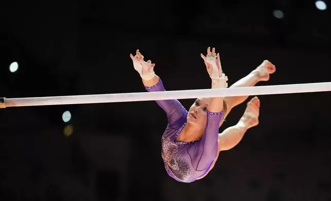 Individual Neutral Athlete Angelina Melnikova competes in the women's uneven bars final during the 53rd Artistic Gymnastics World Championships in Jakarta, Indonesia, Friday, Oct. 24, 2025. (AP Photo/Dita Alangkara)
