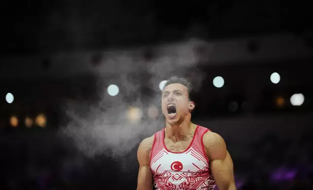 Adem Asil of Turkey reacts after competing in the men's rings final during the 53rd Artistic Gymnastics World Championships in Jakarta, Indonesia, Friday, Oct. 24, 2025. (AP Photo/Dita Alangkara)