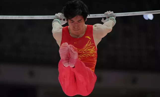 Zhang Boheng of China competes in the Men's All-Around Final during the 53rd Artistic Gymnastics World Championships in Jakarta, Indonesia, Wednesday, Oct. 22, 2025. (AP Photo/Dita Alangkara)