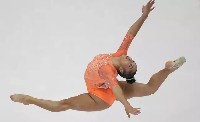 Julia Soares of Brazil performs her floor exercise routine during the 53rd Artistic Gymnastics World Championships in Jakarta, Indonesia, Tuesday, Oct. 21, 2025. (AP Photo/Achmad Ibrahim)