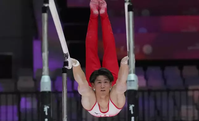Daiki Hashimoto of Japan competes on the parallel bars during the 53rd Artistic Gymnastics World Championships in Jakarta, Indonesia, Sunday, Oct. 19, 2025. (AP Photo/Dita Alangkara)