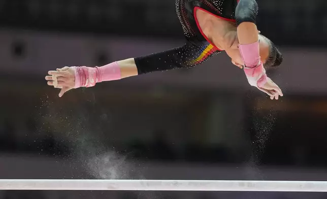 Anamaria Mihaescu of Romania competes on the uneven bars during the 53rd Artistic Gymnastics World Championships in Jakarta, Indonesia, Tuesday, Oct. 21, 2025. (AP Photo/Dita Alangkara)