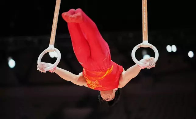 Zhang Boheng of China competes in the men's rings final during the 53rd Artistic Gymnastics World Championships in Jakarta, Indonesia, Friday, Oct. 24, 2025. (AP Photo/Dita Alangkara)