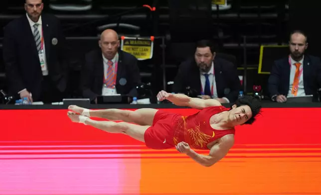 Zhang Boheng of China competes on the vault during the 53rd Artistic Gymnastics World Championships in Jakarta, Indonesia, Monday, Oct. 20, 2025. (AP Photo/Tatan Syuflana)