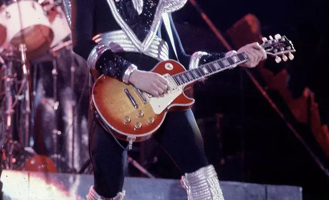 FILE - Ace Frehley, lead guitarist for the hard-rock glam band KISS, performs with a Les Paul guitar during a concert at the Civic Center in Harford, Conn., Feb. 16, 1977. (AP Photo/Richard Drew, File)