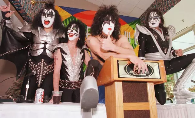 FILE - Members of the rock group Kiss, from left, Gene Simmons, Peter Criss, Paul Stanley and Ace Frehley, pose for pictures during a news conference Friday, Jan. 29, 1999, at Pro Player Stadium in Miami. (AP Photo/Ron Heflin, File)