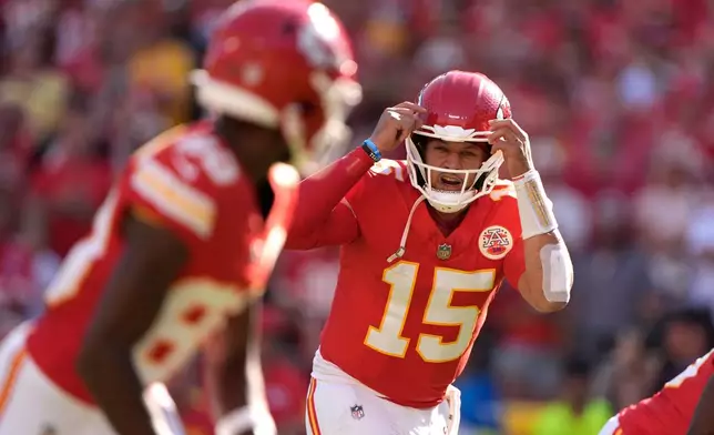 Kansas City Chiefs quarterback Patrick Mahomes calls out on the line of scrimmage during the first half of an NFL football game against the Baltimore Ravens Sunday, Sept. 28, 2025, in Kansas City, Mo. (AP Photo/Charlie Riedel)