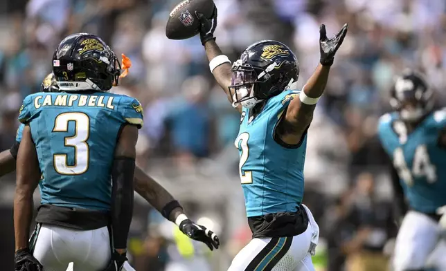 Jacksonville Jaguars cornerback Jourdan Lewis (2) reacts after intercepting a pass by Houston Texans quarterback CJ. Stroud, not visible, during the second half of an NFL football game Sunday, Sept. 21, 2025, in Jacksonville, Fla. (AP Photo/Phelan M. Ebenhack)