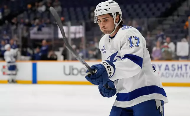 Tampa Bay Lightning center Dominic James (17) warms up before an NHL hockey game against the Nashville Predators, Tuesday, Oct. 28, 2025, in Nashville, Tenn. (AP Photo/George Walker IV)