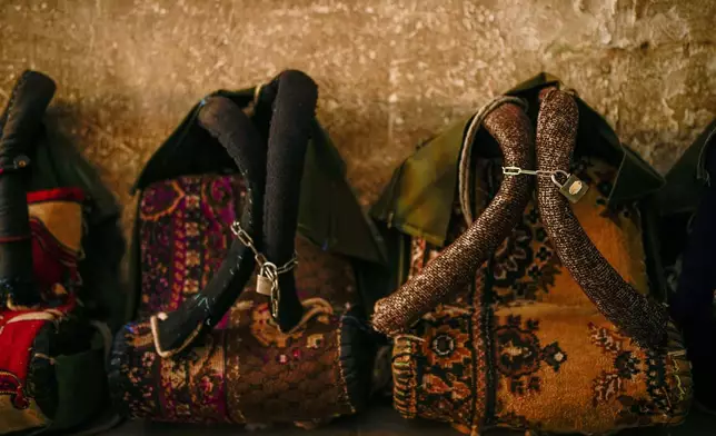 Locked harnesses used by porters sit at a porter headquarters in Istanbul, Turkey, Monday, Aug. 18, 2025. (AP Photo/Emrah Gurel)