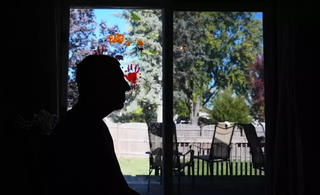 Bill Swick sits on the chair at his home in Minooka, Ill., Friday, Oct. 24, 2025. (AP Photo/Nam Y. Huh)