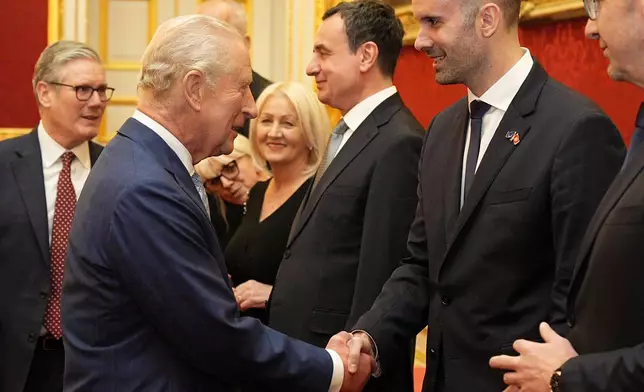 Britain's King Charles III greets the Prime Minister of Montenegro Milojko Spajic, during a reception for Western Balkans leaders at St James's Palace, London, Tuesday, Oct. 21, 2025, on the eve of the Western Balkans Leaders' Summit. (Aaron Chown/Pool Photo via AP)