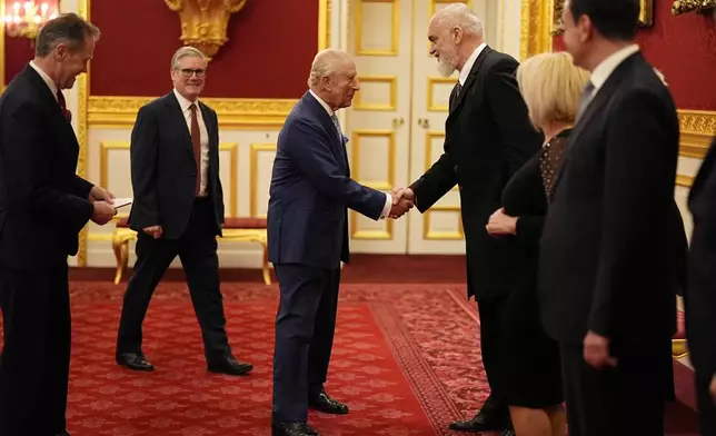 Britain's King Charles III greets the Prime Minister of the Republic of Albania Edi Rama, during a reception for Western Balkans leaders at St James's Palace, London, Tuesday, Oct. 21, 2025, on the eve of the Western Balkans Leaders' Summit. (Aaron Chown/Pool Photo via AP)