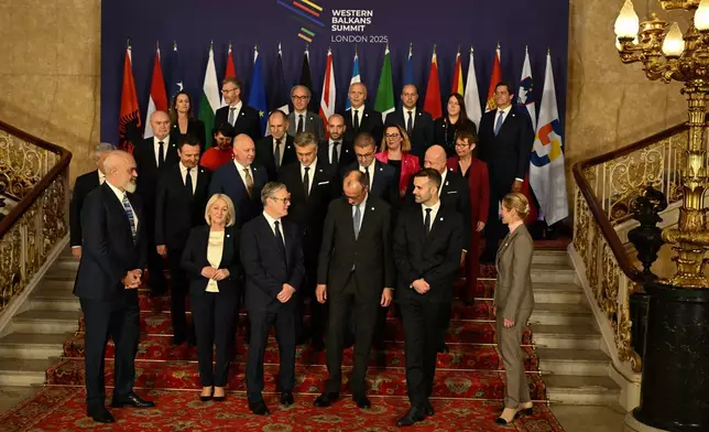 Leaders and delegates prepare to pose for the group photo during a Western Balkans Summit in London, Wednesday, Oct. 22, 2025. (Chris J Ratcliffe/Pool Photo via AP)