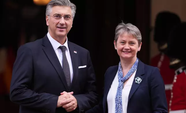 Britain's Foreign Secretary Yvette Cooper welcomes Croatia's Prime Minister Andrej Plenkovic to a meeting of leaders of six Western Balkan nations with British and European officials at a Western Balkans Summit in London, Wednesday, Oct. 22, 2025.(AP Photo/Kirsty Wigglesworth, Pool)