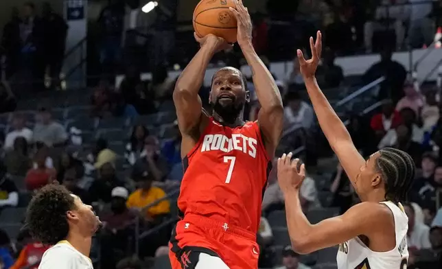 Houston Rockets forward Kevin Durant (7) shoots against the New Orleans Pelicans during the first half of an NBA preseason basketball game, Tuesday, Oct. 14, 2025, in Birmingham, Ala. (AP Photo/Mike Stewart)