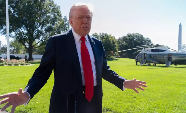 President Donald Trump speaks to reporters before departing the White House, en route Norfolk, Va., to observe a naval sea power demonstration, Sunday, Oct. 5, 2025, in Washington. (AP Photo/Manuel Balce Ceneta)