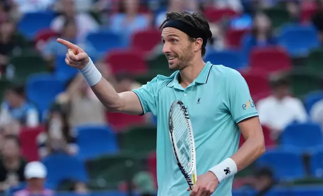 Arthur Rinderknech of France reacts after defeating Felix Auger-Aliassime of Canada in their men's singles quarterfinal match of the Shanghai Masters tennis tournament at Qizhong Forest Sports City Tennis Center in Shanghai, China, Friday, Oct. 10, 2025. (AP Photo/Andy Wong)