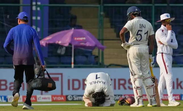 India's KL Rahul sits on the ground after West Indies' Jayden Seales delivery hits him on the fourth day of the second cricket test match between India and West Indies at the Arun Jaitley Stadium in New Delhi, India, Monday, Oct.13, 2025. (AP Photo/Manish Swarup)