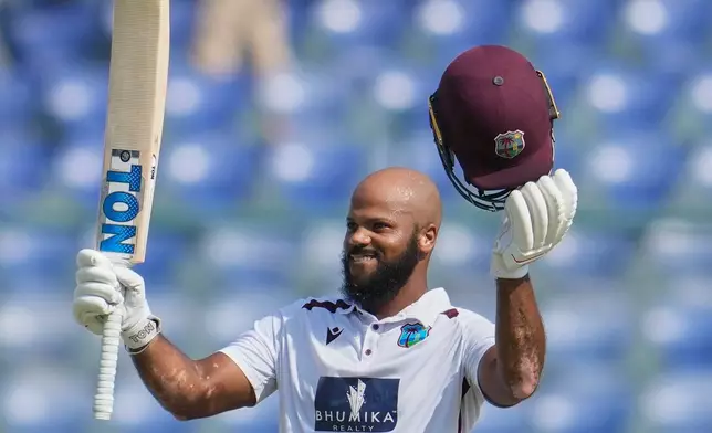 West Indies' John Campbell celebrates after scoring a century on the fourth day of the second cricket test match between India and West Indies at the Arun Jaitley Stadium in New Delhi, India, Monday, Oct.13, 2025. (AP Photo/Manish Swarup)