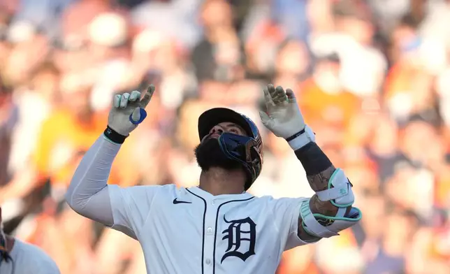 Detroit Tigers' Gleyber Torres celebrates after hitting a solo home run during the seventh inning in Game 4 of baseball's American League Division Series against the Seattle Mariners Wednesday, Oct. 8, 2025, in Detroit. (AP Photo/Paul Sancya)