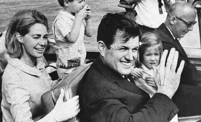 FILE - Senator Edward Kennedy and Wife Joan Kennedy leave West Palm Beach airport for the drive to his father's home and vacation at Palm Beach. . (AP Photo/FILE)