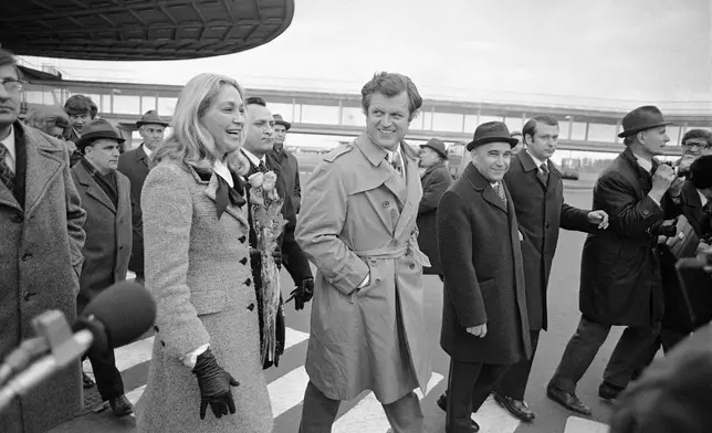 FILE - Sen. Edward Kennedy, D-Mass, center, with his wife, Joan Kennedy, and Russia's Chief of International Relations Vasily Vysotin, third from left, at the airport, Thursday, April 18, 1974, Moscow, Russia. The men on the right and left of Mr. Kennedy are unidentified. (AP Photo/BY, File)