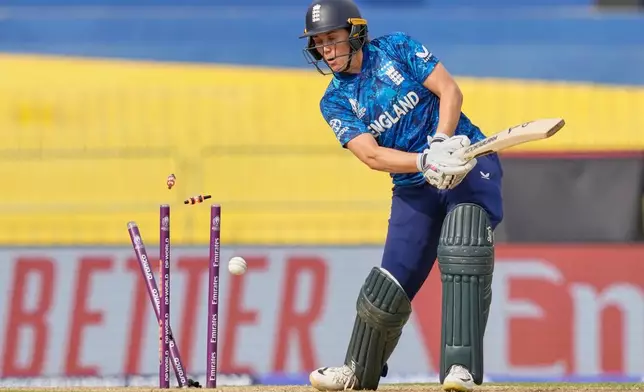 England's captain Nat Sciver-Brunt is bowled out by Pakistan's captain Fatima Sana during the ICC Women's Cricket World Cup match between England and Pakistan at Premadasa Stadium in Colombo, Sri Lanka, Wednesday, Oct, 15, 2025. (AP Photo/Eranga Jayawardena)