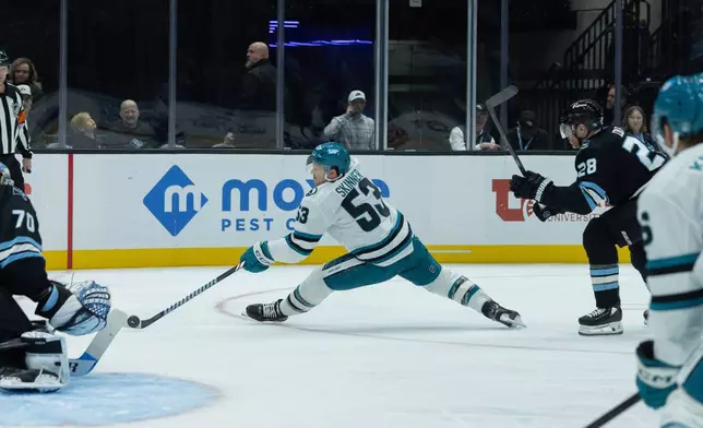 San Jose Sharks left wing Jeff Skinner (53) goes to shoot the puck against Utah Mammoth goalie Karel Vejmelka (70) during the first period of an NHL hockey game Friday, Oct. 17, 2025, in Salt Lake City. (AP Photo/Melissa Majchrzak)