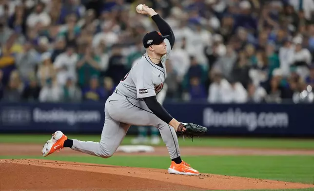 Detroit Tigers pitcher Tarik Skubal throws during the first inning in Game 5 of baseball's American League Division Series against the Seattle Mariners, Friday, Oct. 10, 2025, in Seattle. (AP Photo/John Froschauer)