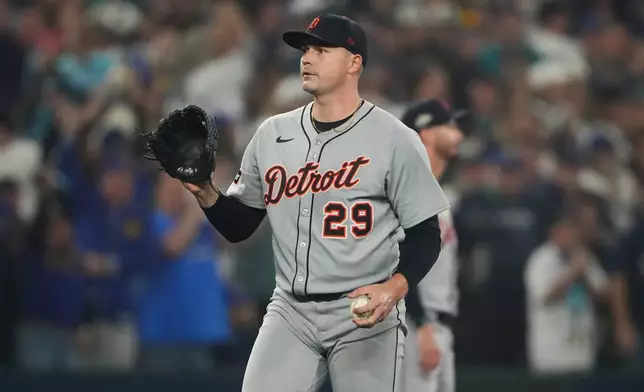 Detroit Tigers pitcher Tarik Skubal (29) reacts after Seattle Mariners first baseman Josh Naylor hit a double during the second inning in Game 5 of baseball's American League Division Series Friday, Oct. 10, 2025, in Seattle. (AP Photo/Lindsey Wasson)