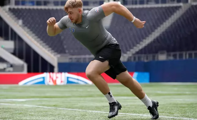 FILE - Offensive lineman Leander Wiegand, of Germany, participates in a drill at the NFL international scouting combine at Tottenham Hotspur Stadium in London, Tuesday, Oct. 4, 2022. (AP Photo/Steve Luciano, File)