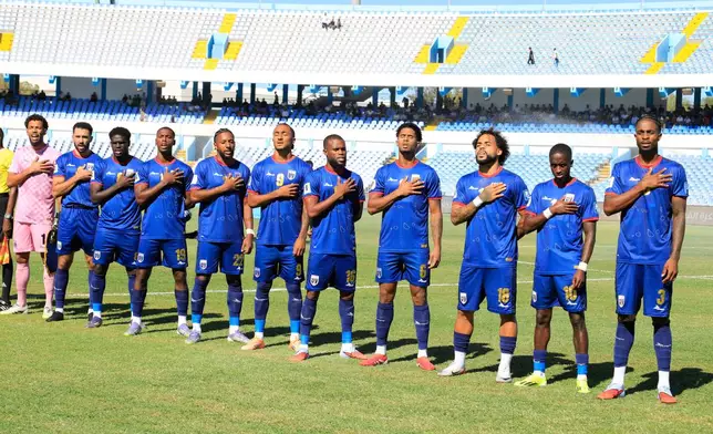 Cape Verde players stand for the national anthem during the World Cup 2026 African qualifier Group D soccer match between Libya and Cape Verde in Tripoli, Libya, Wednesday, Oct. 8, 2025. (AP Photo/Yousef Murad)